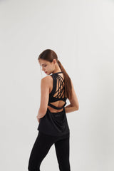 An easy and flattering fit that floats away from your body. With open back so you can show off your bra details. Also, it has beautiful drapes details at the back. Quick dry, light and comfortable on your skin. From all day, practicing to pacing you decide. It is a staple piece!